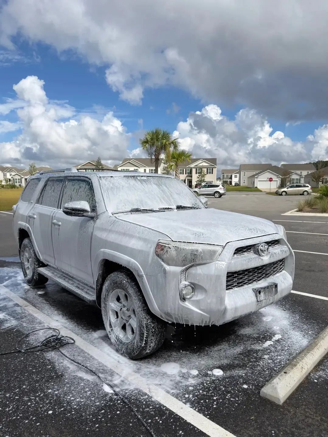 Toyota 4Runner covered in foam during a wash